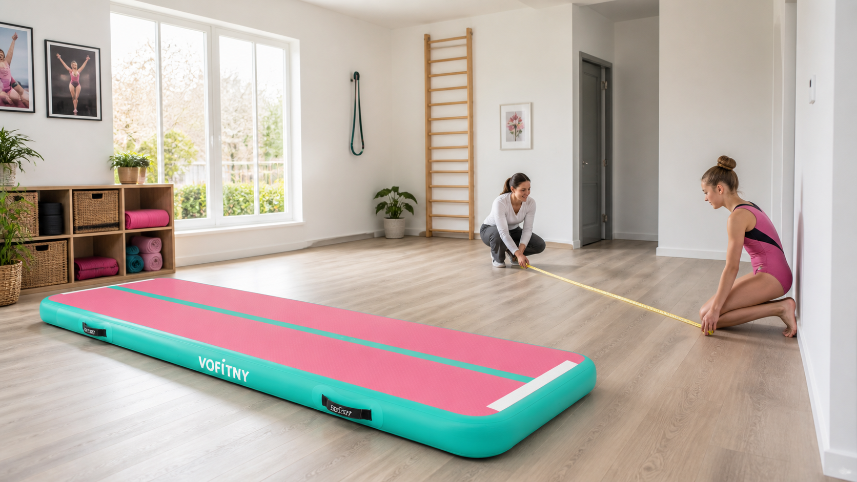 Gymnast and coach measuring a home training space beside a VOFiTNY inflatable air mat